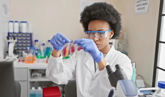 Scientist mixing samples in tubes