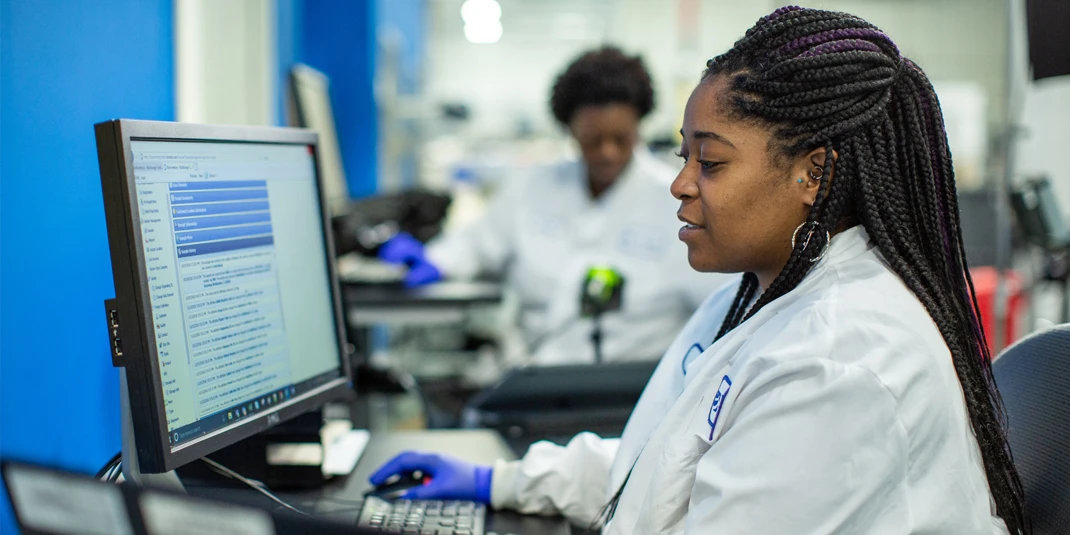 Scientist analyzing data on computer