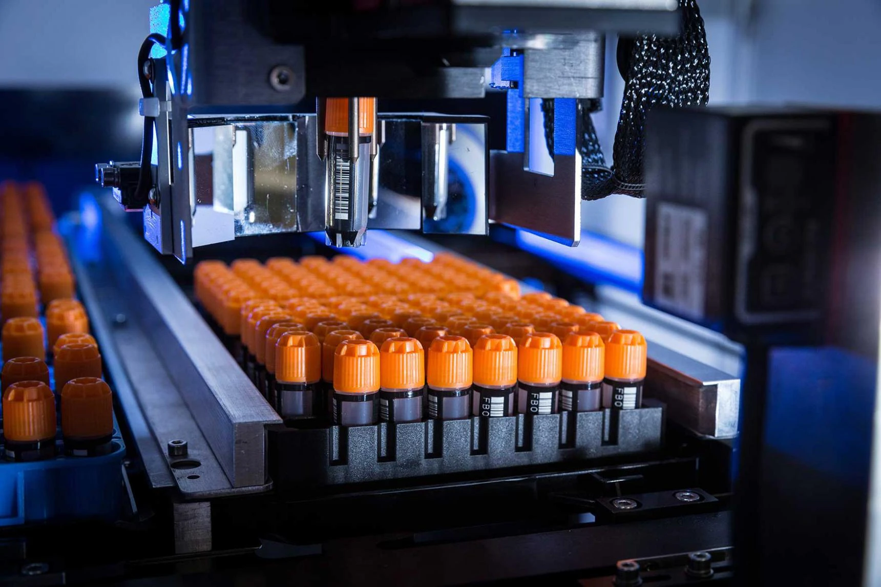 Automated tube picker inside a storage unit