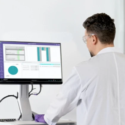 Lab technician next to storage unit