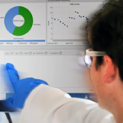 Lab technician selecting featured on screen of cryogenic storage unit